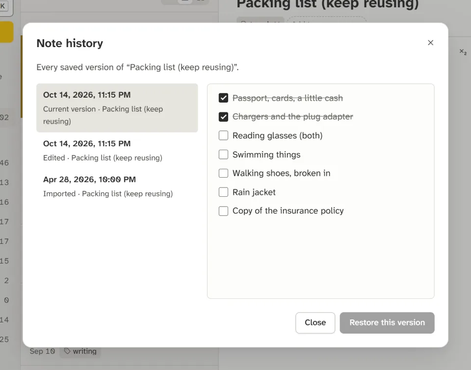 The note history window listing three versions of a packing list, with a preview and a Restore this version button.